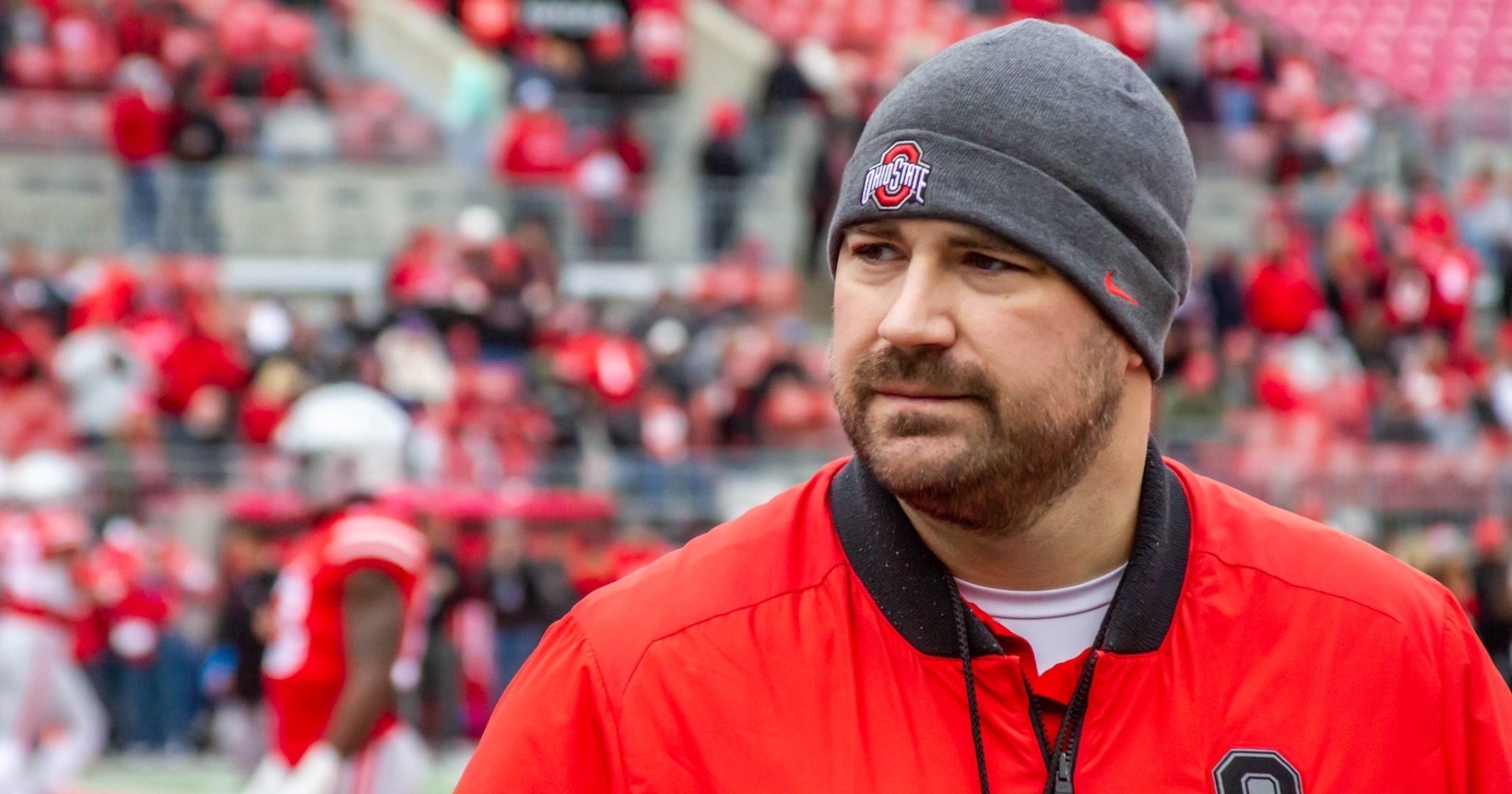 Justin Kume is wearing Ohio State gear at the Ohio State football stadium. 